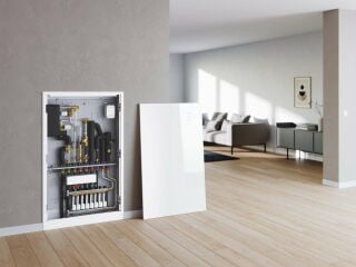 Systembeispiel Aufbau der Wärmeversorgung mit Wohnungsstationen und einem zentralen Heizkessel samt Pufferspeicher.