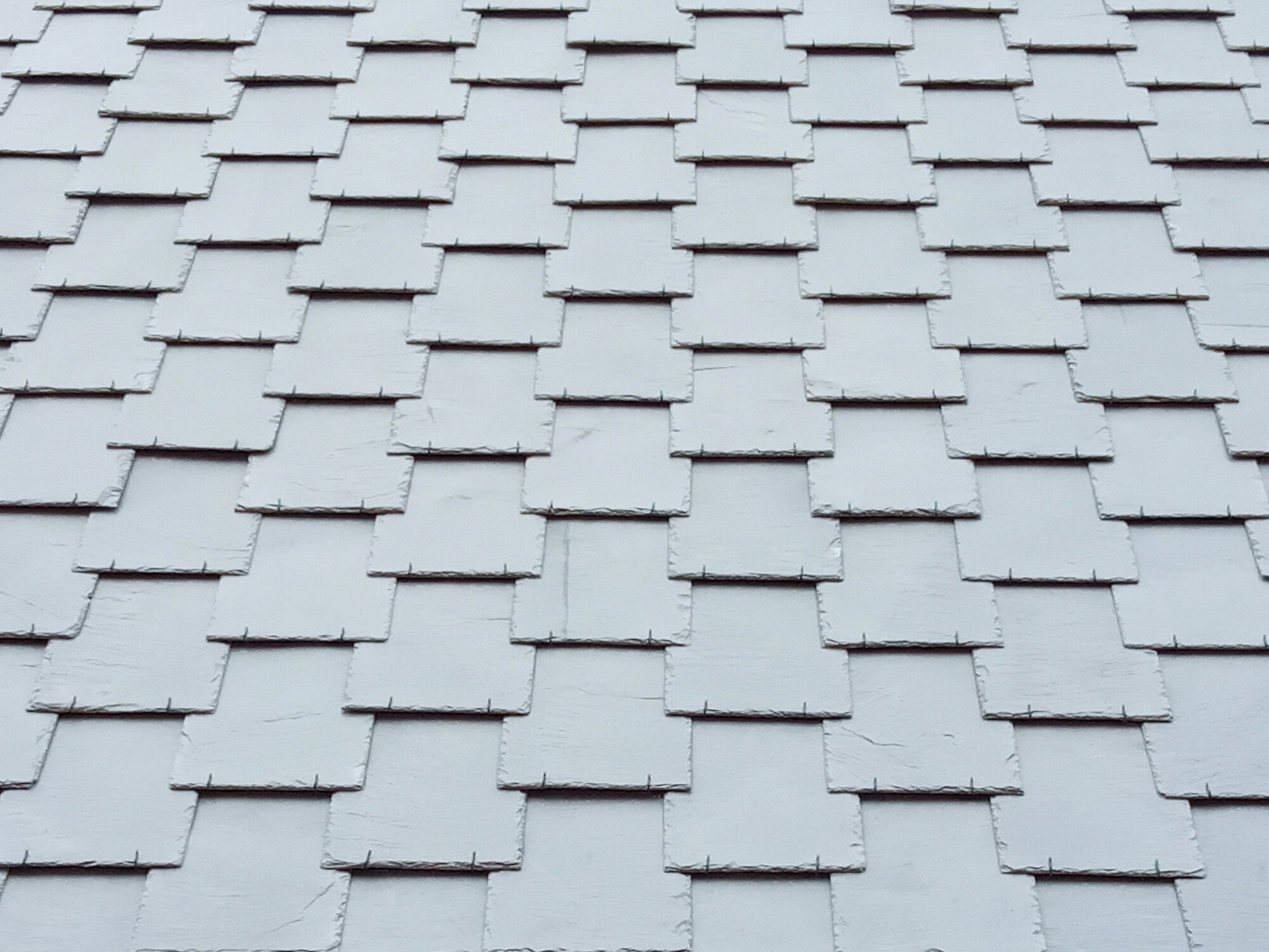 Fassade mit Schiefer als gezogene Deckung