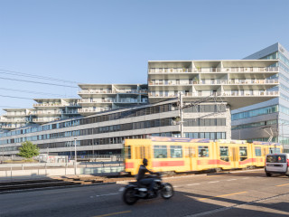 Im Gewerbegebiet Dreispitz zwischen Basel und Münchenstein schufen die Architekten von BIG – Bjarke Ingels Group einen zeichenhaften Hybrid aus Alt und Neu