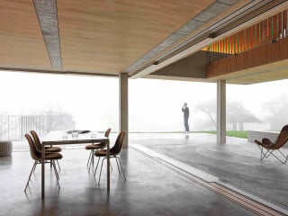 Beim Neubau eines Wohnhauses mit Zahnarztpraxis in Buchberg interpretierte das Architekturbüro Gus Wüstemann die Struktur der traditionellen Bauten des Ortes neu.