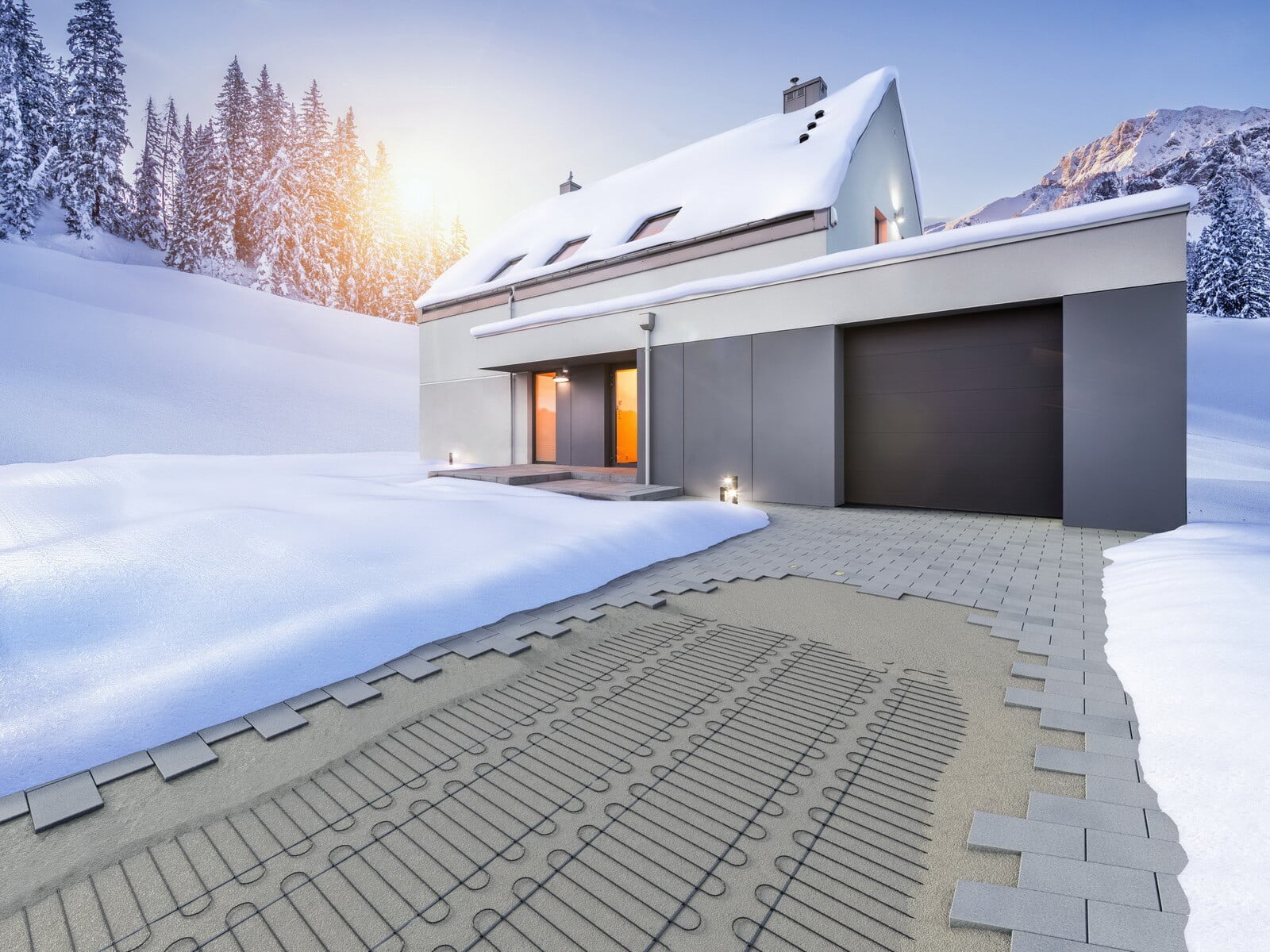 Einfahrten können im Winter durch eine elektrische Freiflächenheizung frei von Schnee und Eis gehalten werden, ohne die Umwelt mit Streusalz zu belasten.