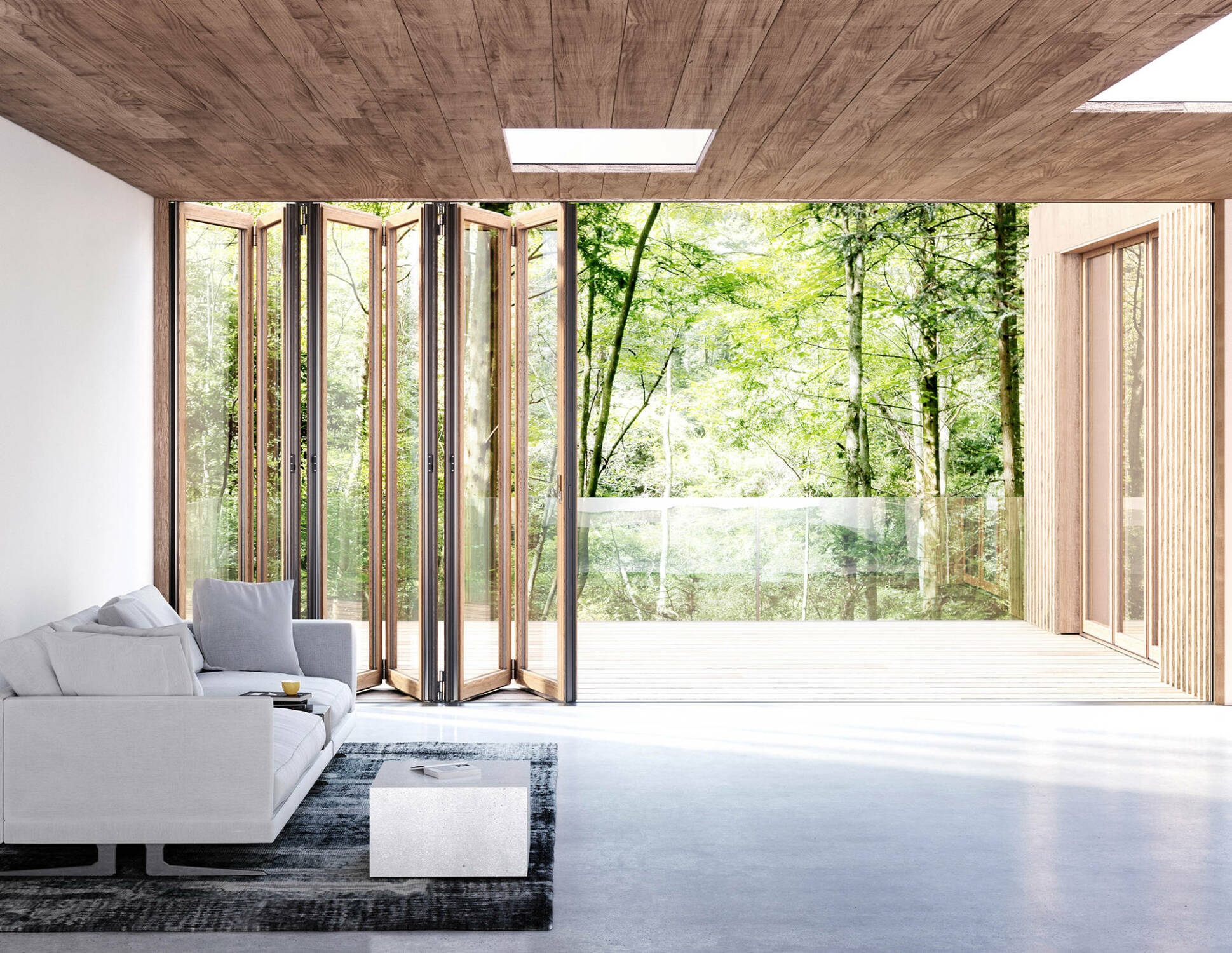 Auch Wohnräume lassen sich im Sommer mittels Glasfaltwänden großflächig und nahtlos zum Außenraum öffnen (hier: Woodline von Solarlux).
