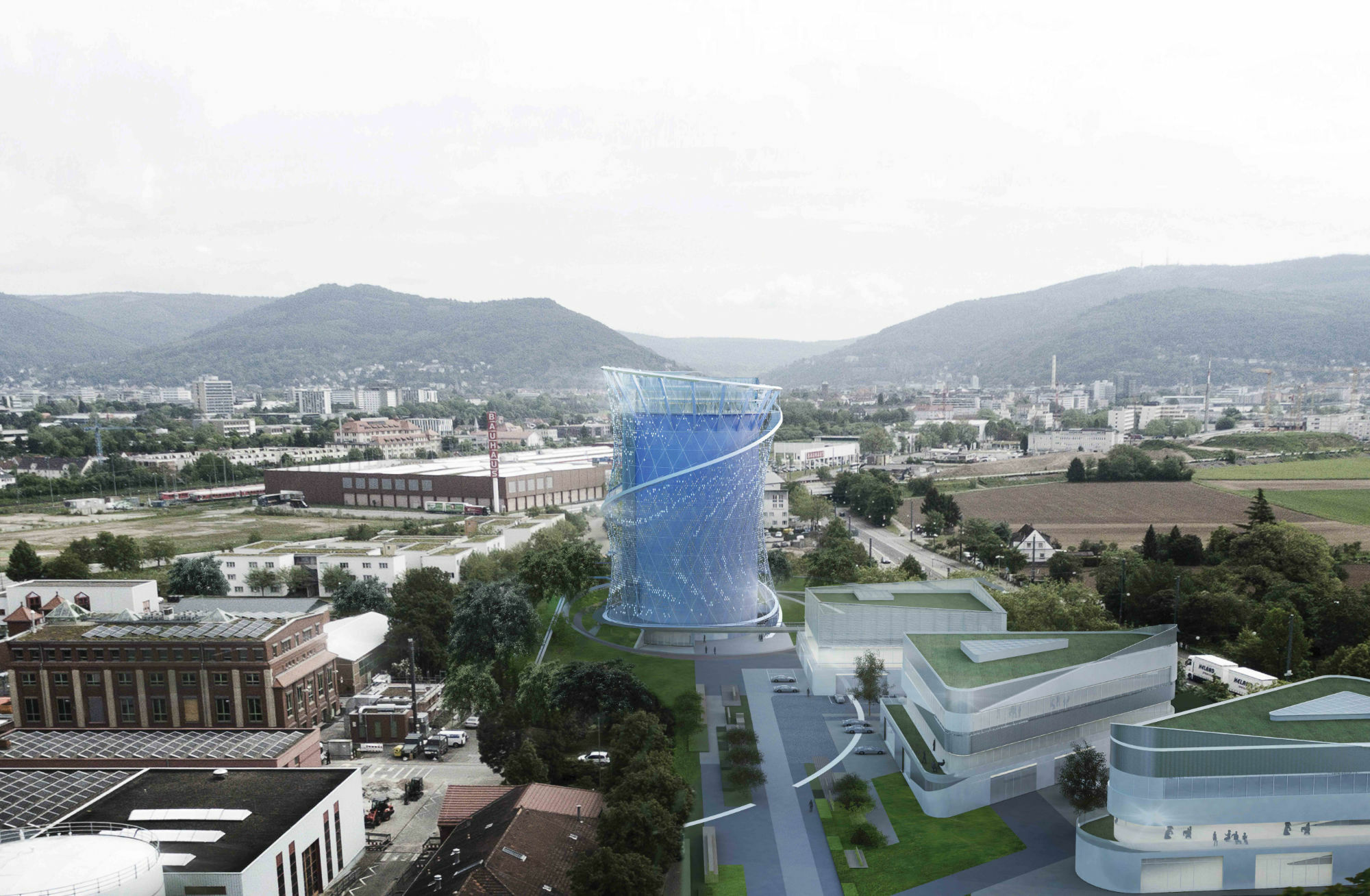 Der blaue Turm wird aktuell am Rande des Stadtteils Pfaffengrund errichtet, umgeben von Gewerbegebieten, einer Gartenbau-Anstalt und Feldern.