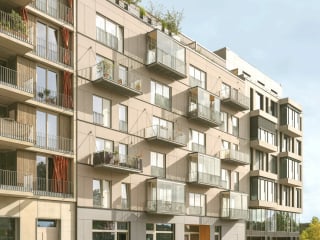 Die tragenden Fassaden des Geschosswohnungsbaus nach Plänen von Scharabi Architekten sind hofseitig mit Lärchenholz bekleidet.