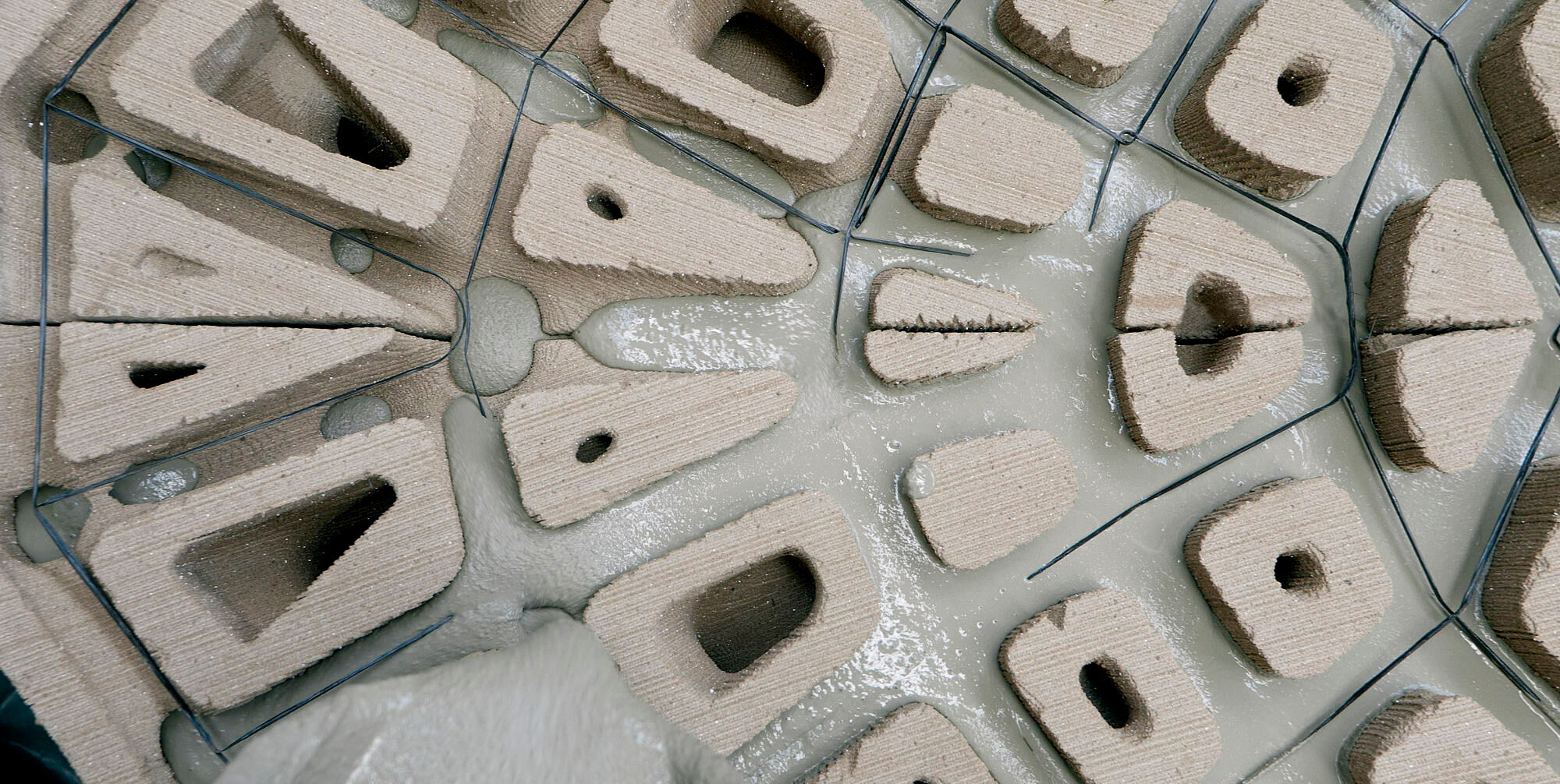 Betonieren einer geometrisch optimierten Struktur in 3D-gedruckter Sandschalung